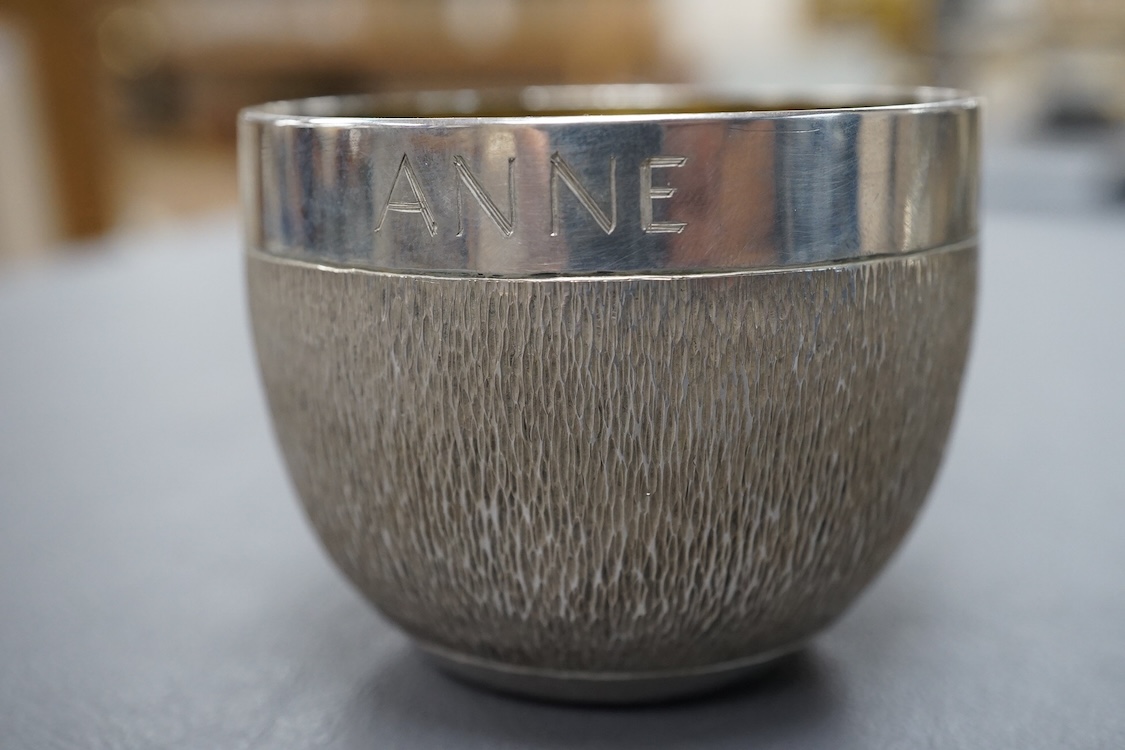 An Elizabeth II textured silver tumbler cup, possibly by Keith Tyssen, London, 1975, with later engraved inscription, height 50mm, 136 grams.